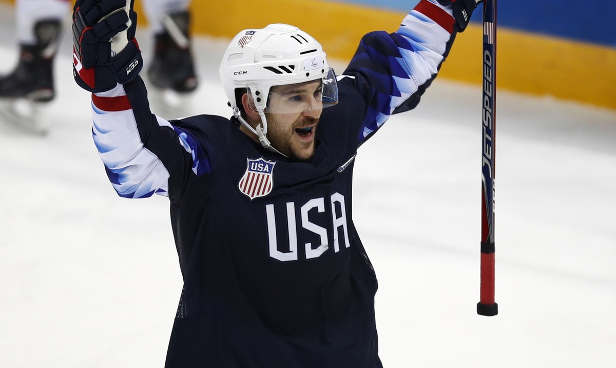 Garrett Roe (11), of the United States, celebrates after scoring a goal against Slovakia during the third period of the qualification round of the men's hockey game at the 2018 Winter Olympics in ...