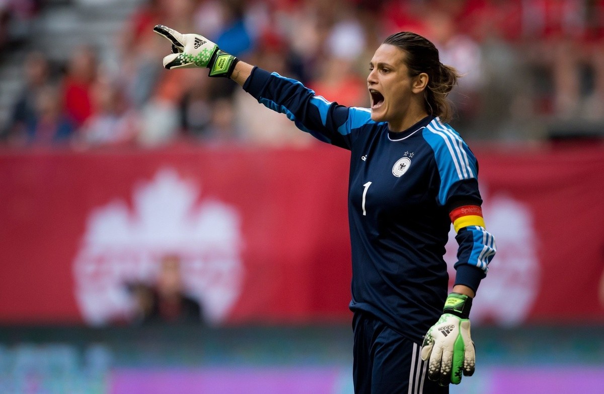FILE - In this June 18, 2014, file photo, Germany's goalkeeper Nadine Angerer calls out instructions to her teammates during the first half of an international friendly soccer game against Canada ...