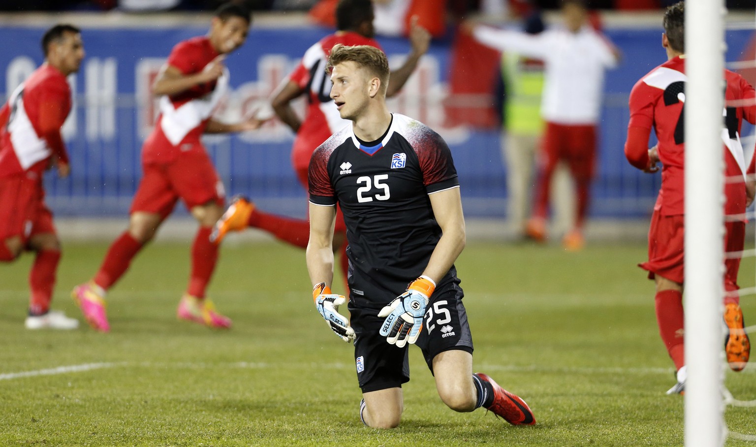 Iceland goalkeeper Frederik Schram reacts after giving up a goal to Peru forward Jefferson Farfan during the second half of an international friendly soccer match Tuesday, March 27, 2018, in Harrison, ...