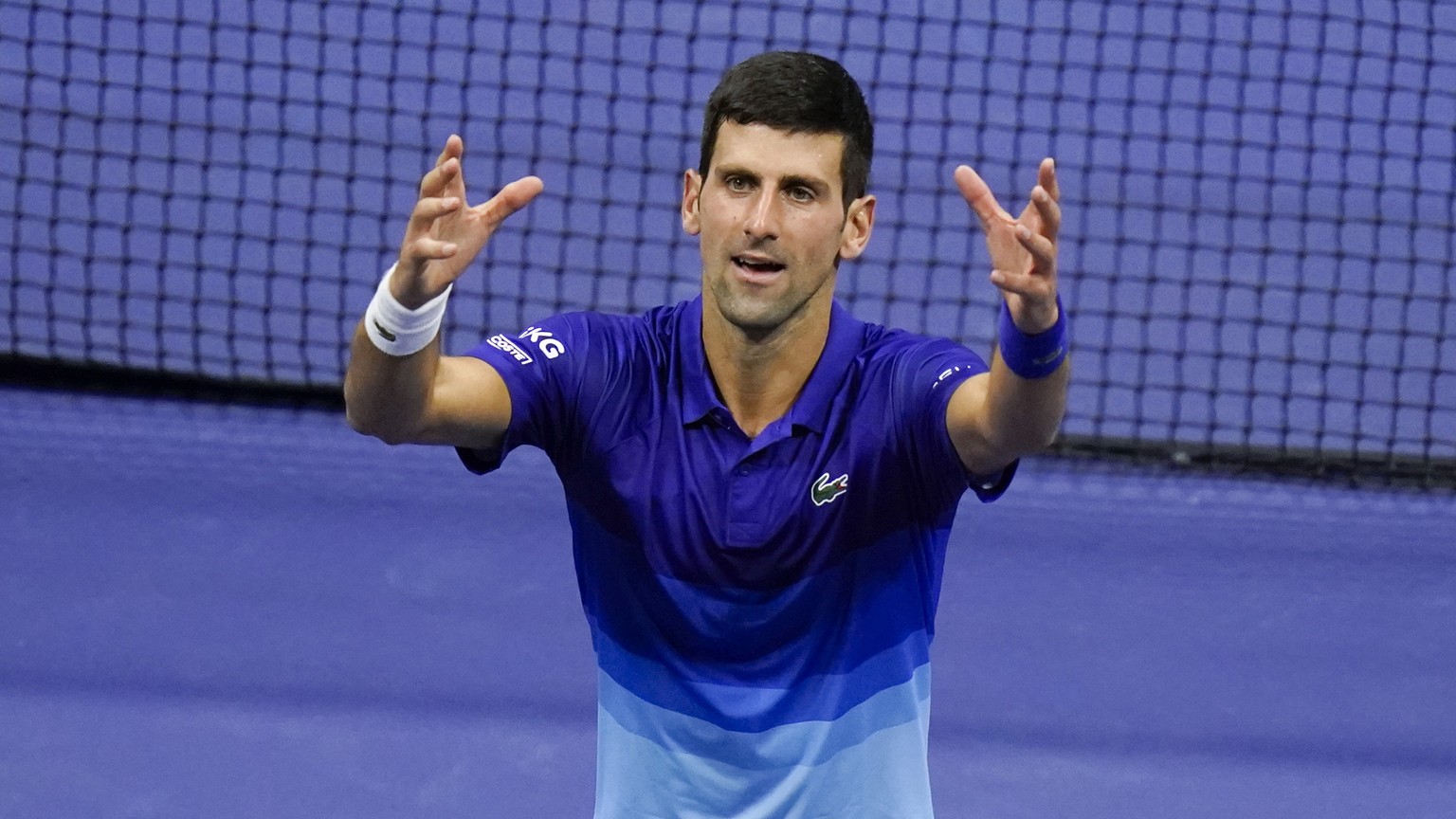 Novak Djokovic, of Serbia, reacts after defeating Alexander Zverev, of Germany, during the semifinals of the US Open tennis championships, Friday, Sept. 10, 2021, in New York. (AP Photo/Seth Wenig)