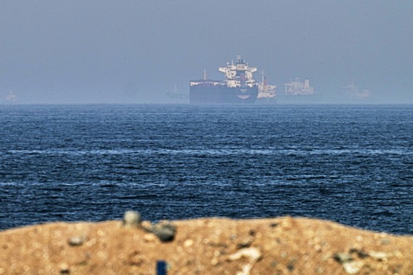 Cargo ships are seen at sea near the Strait of Hormuz, as viewed from a rocky shoreline near Khor Fakkan, United Arab Emirates, Friday, May 1, 2026. (AP Photo/Fatima Shbair)
Emirates Iran War Strait o ...