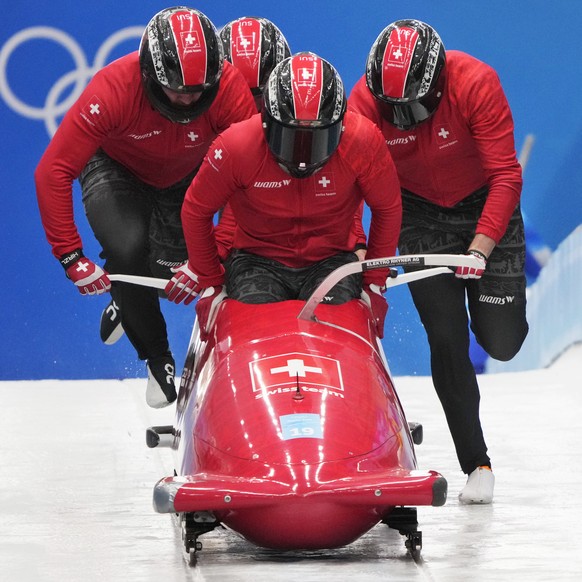 Michael Vogt of Switzerland and his team start during a 4-man bobsleigh training heat at the 2022 Winter Olympics, Wednesday, Feb. 16, 2022, in the Yanqing district of Beijing. (AP Photo/Dmitri Lovets ...