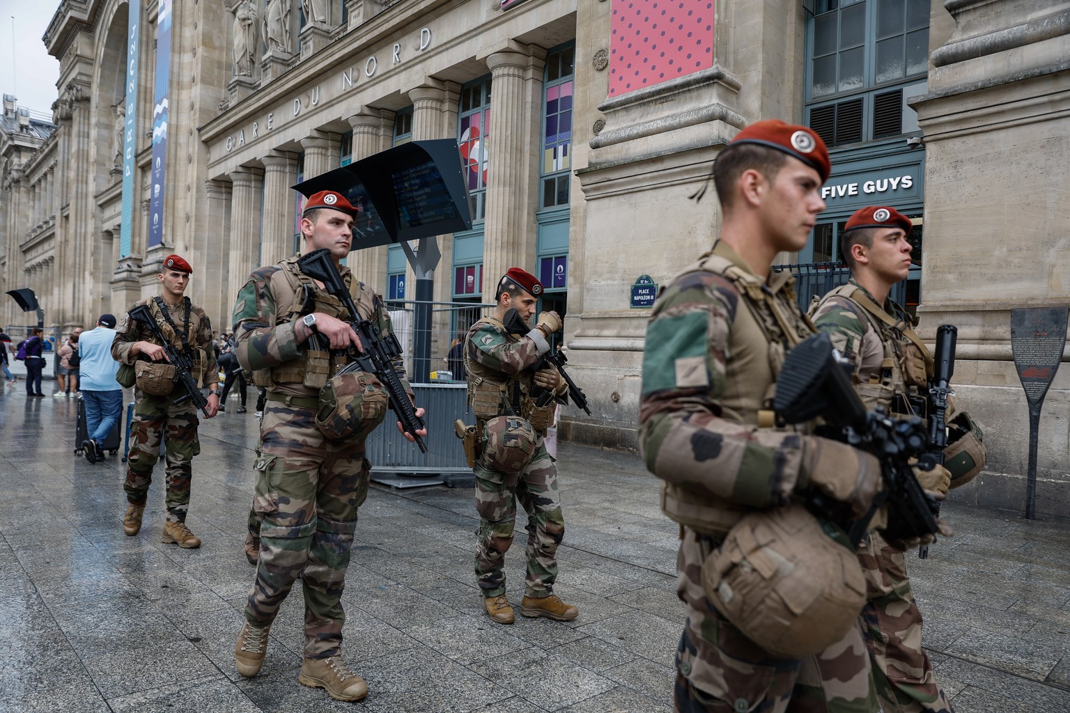 epa11496938 French military personnel patrol outside Gare du Nord station in Paris, France, 26 July 2024. France&#039;s high speed rail network TGV was severely disrupted on 26 July following a &#039; ...
