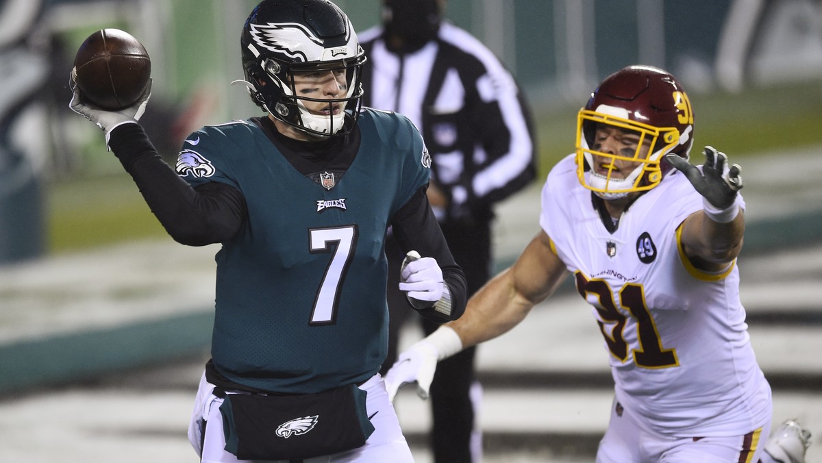 Philadelphia Eagles' Nate Sudfeld (7) passes against Washington Football Team's Ryan Kerrigan (91) during the second half of an NFL football game, Sunday, Jan. 3, 2021, in Philadelphia. (AP  ...