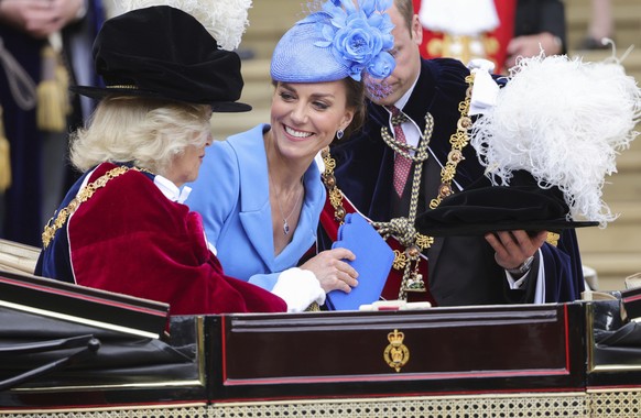 From left to right: Camilla, Duchess of Cornwall, Britain's Kate, Duchess of Cambridge and Prince William attend the Order of the Garter service at Windsor Castle, in Windsor, England, Monday, June 13, 2022. T...