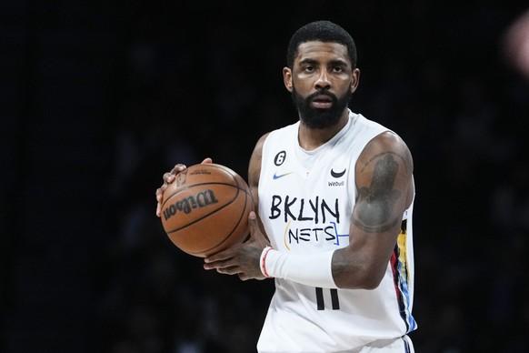 Brooklyn Nets&#039; Kyrie Irving (11) looks to pass the ball during the first half of an NBA basketball game against the Oklahoma City Thunder, Sunday, Jan. 15, 2023 in New York. (AP Photo/Frank Frank ...