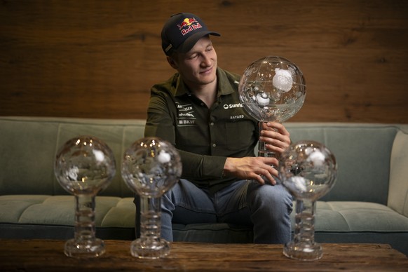 Marco Odermatt of Switzerland poses with his crystal globes for Giant Slalom, Super-G, Downhill, and Overall, after the men&#039;s downhill race at the FIS Alpine Skiing World Cup finals in Saalbach-H ...
