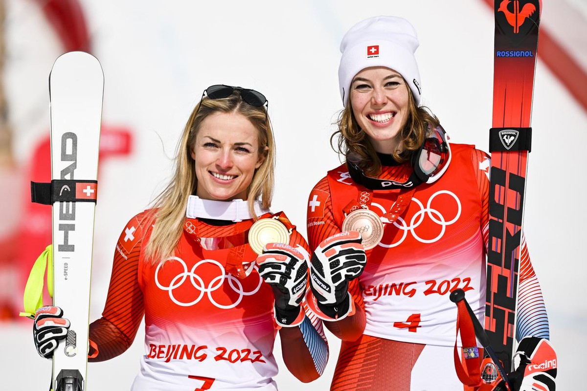 Gold medalist Lara Gut-Behrami of Switzerland, left, celebrates with bronze medalist Michelle Gisin of Switzerland, right, during the victory ceremony of the women's Alpine Skiing Super-G race at ...