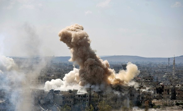 FILE - In this file photo released on Sunday, April 22, 2018 by the Syrian official news agency SANA, smoke rises after Syrian government airstrikes and shelling hit in Hajar al-Aswad neighborhood hel ...