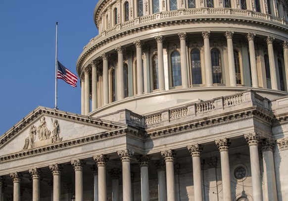 The American flag flies at half-staff at the Capitol in honor of Sen. John McCain of Arizona who died Saturday of brain cancer, in Washington, Monday, Aug. 27, 2018. McCain will lie in state in the Ca ...