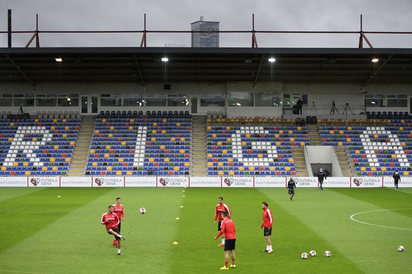 Swiss soccer national team players warm up during a training session on the eve of the 2018 Fifa World Cup group B qualifying soccer match Latvia against Switzerland at Skonto Stadium, in Riga, Latvia ...