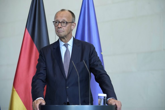 German Chancellor Friedrich Merz attends a joint press statement with Ukrainian President Volodymyr Zelenskyy following talks with European and U.S. leaders in Berlin, Germany, Wednesday, Aug. 13, 202 ...