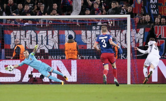Basel's Taulant Xhaka, right, scores past CSKA goalkeeper Igor Akinfeev his side's first goal during the Champions League Group A soccer match between CSKA Moscow and Basel in Moscow, Russia, Wednesday, Oct. 18, 2017. (AP Photo/Ivan Sekretarev)