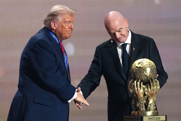 FILE - FIFA President Gianni Infantino presents President Donald Trump with the FIFA Peace Prize during the draw for the 2026 soccer World Cup at the Kennedy Center in Washington, Friday, Dec. 5, 2025 ...