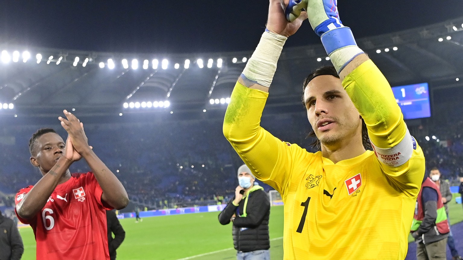 Switzerland&#039;s goalkeeper Yann Sommer, cnter, and Switzerland&#039;s defender Denis Zakaria, left, cheer after the 2022 FIFA World Cup European Qualifying Group C match between Italy and Switzerla ...