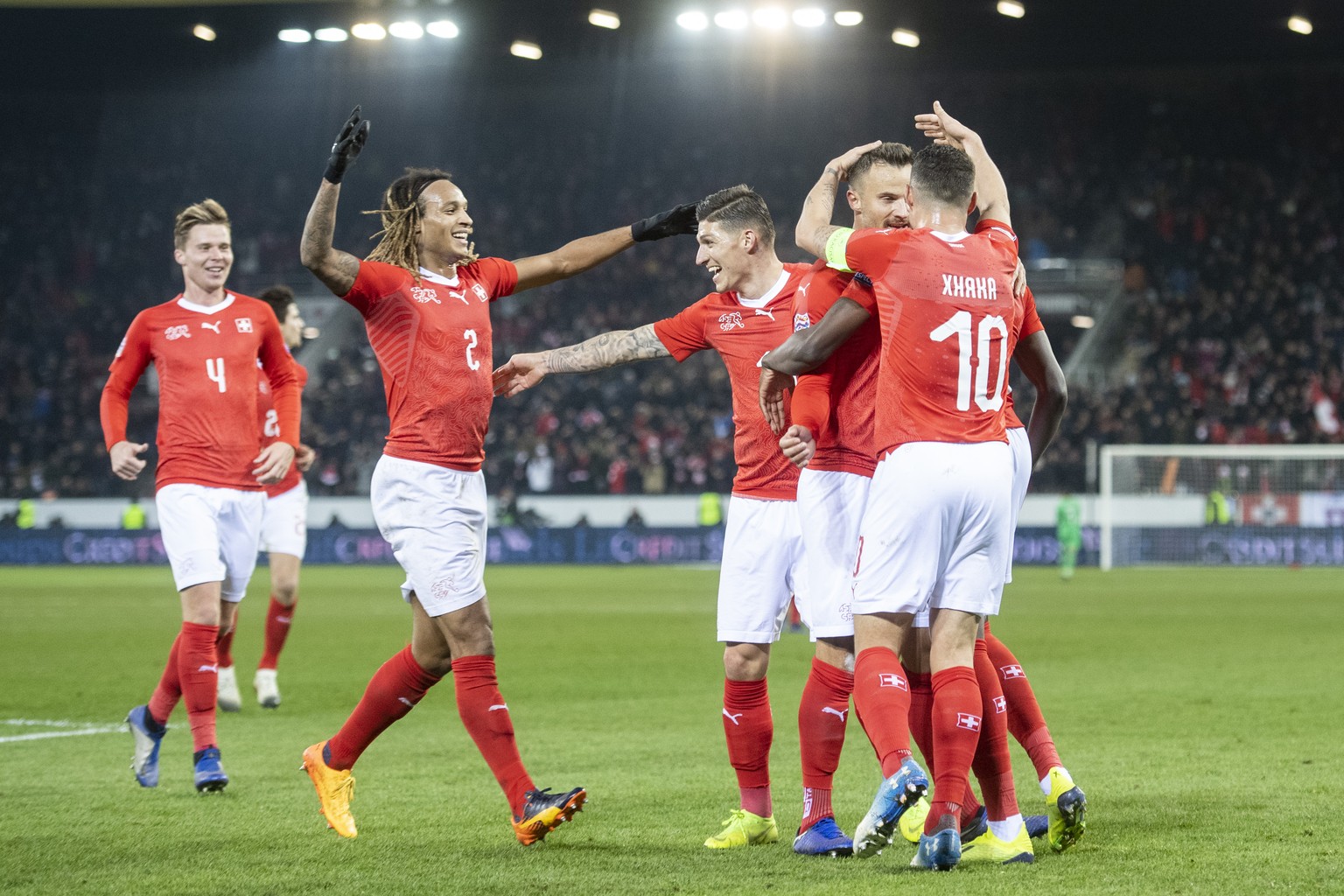 Switzerland celebrate the 5:2 goal of Haris Seferovic during the UEFA Nations League soccer match between Switzerland and Belgium at the swissporarena stadium in Lucerne, Switzerland, on Sunday, Novem ...