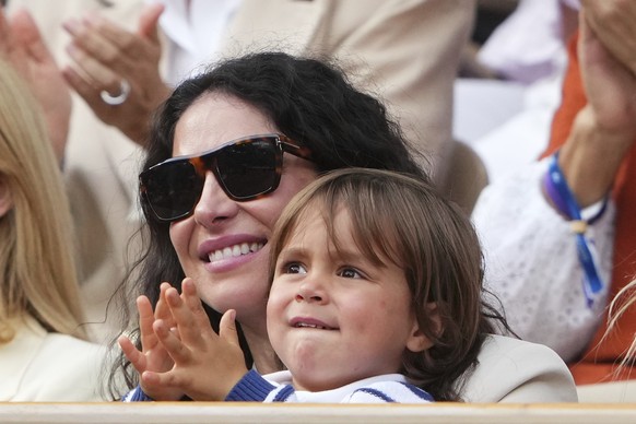 Rafa Nadal's wife, Maria Francisca Perello, holds her son Rafael Junior, during a farewell ceremony at center court Philippe-Chatrier, at the Roland-Garros stadium, in Paris, Sunday May 25, 2025. ...