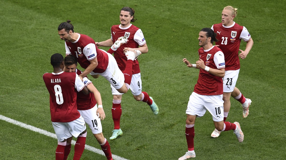 Austria's Christoph Baumgartner celebrates with teammates after scoring his sides first goal during the Euro 2020 soccer championship group C match between Ukraine and Austria at the National Are ...