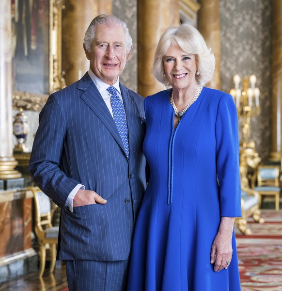 In this photo provided by Buckingham Palace on Tuesday, April 4, 2023, Britain&#039;s King Charles III and Camilla, the Queen Consort pose for a photo in the Blue Drawing Room at Buckingham Palace, Lo ...