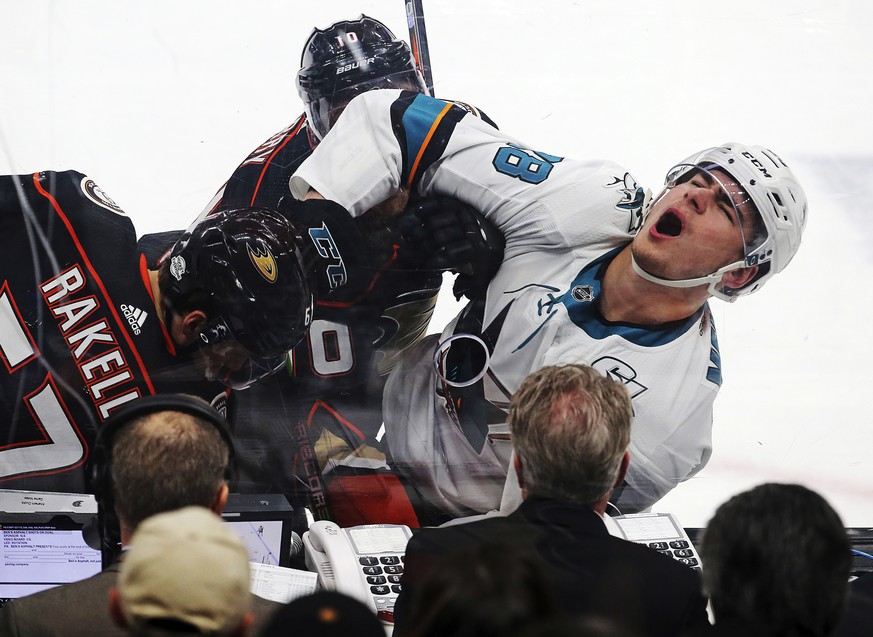 San Jose Sharks right winger Timo Meier, right, and Anaheim Ducks center Rickard Rakell, left, battle against the boards in the first period of an NHL hockey game in Anaheim, Calif., Sunday, Feb. 11,  ...