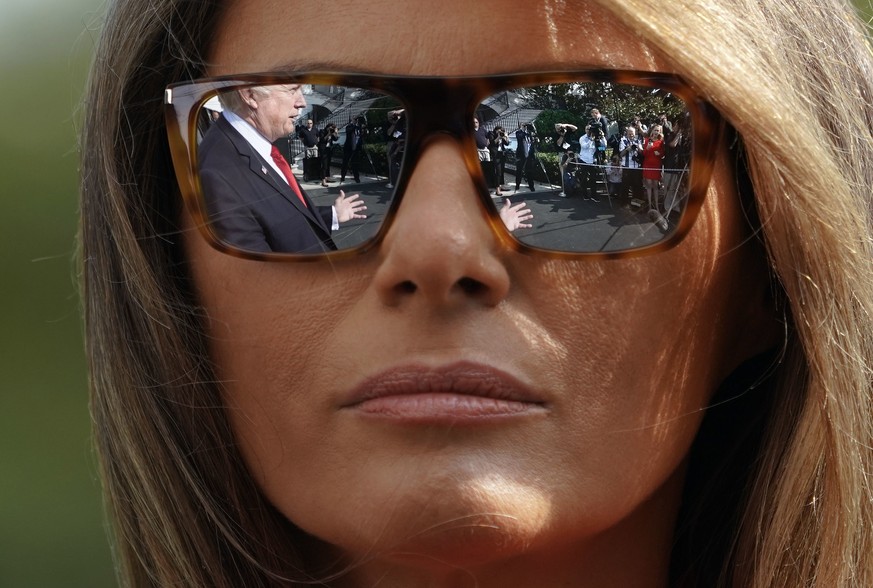 President Donald Trump and first lady Melania Trump walk across the South Lawn of the White House in Washington during their arrival on Marine One helicopter, Sunday, Sept. 10, 2017. (AP Photo/Pablo M ...