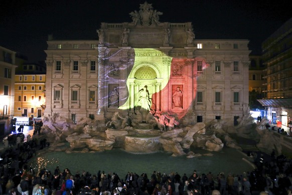 The black, yellow, and red colours of the Belgian flag are projected on the Trevi fountain in Rome, Italy, in tribute to the victims of today&#039;s Brussels bomb attacks March 22, 2016. REUTERS/Stefa ...