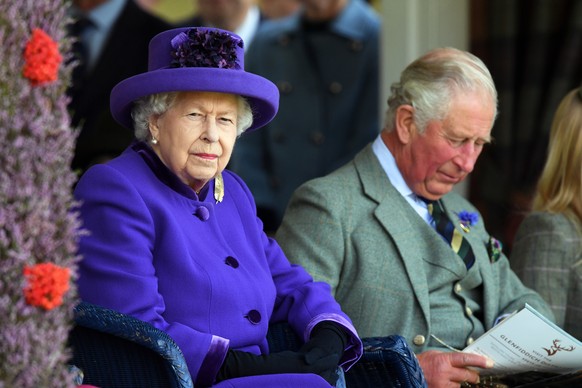 epa07825758 Britain&#039;s Queen Elizabeth II (L) and Charles, Prince of Wales attend the Braemar Gathering at the Princess Royal and Duke of Fife Memorial Park, in Braemar, Scotland, 07 September 201 ...