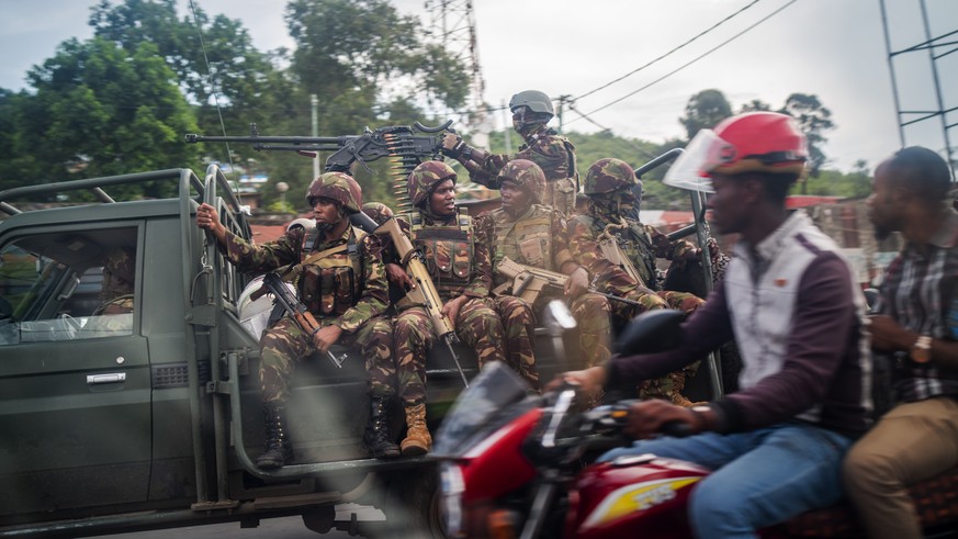 Kenyan forces drive through Goma, Democratic Republic of Congo Friday Nov. 25, 2022. Mediators are calling for a cease-fire to begin Friday evening in eastern Congo. But it remains unclear whether tha ...