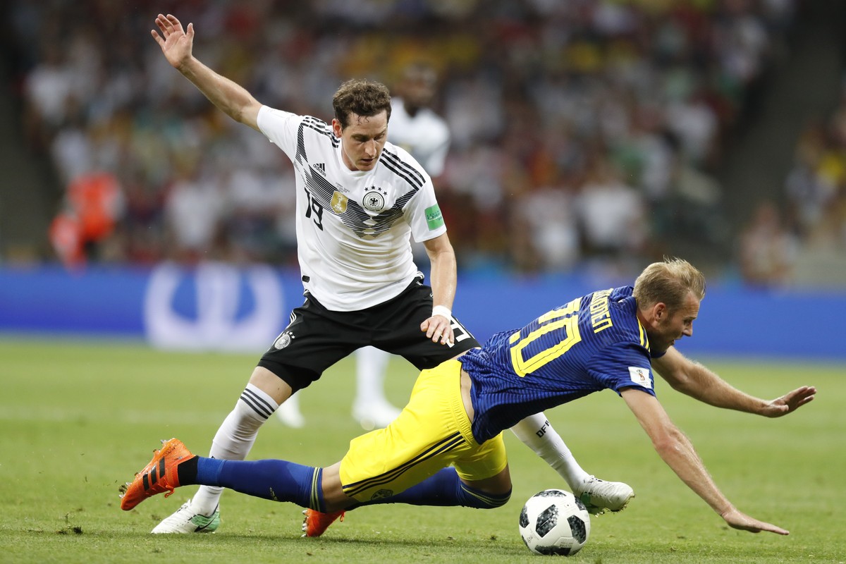 Sweden's Ola Toivonen falls in front of Germany's Sebastian Rudy during the group F match between Germany and Sweden at the 2018 soccer World Cup in the Fisht Stadium in Sochi, Russia, Satur ...