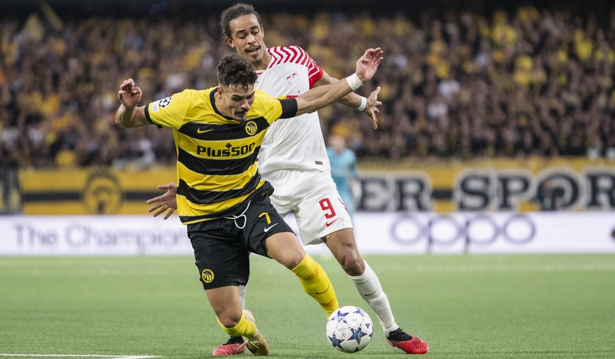 YB's Filip Ugrinic, left, falls fighting with RB Leipzig's Yussuf Poulsen during the Champions League group G soccer match between BSC Young Boys and RB Leipzig, at the Wankdorf stadium, in  ...