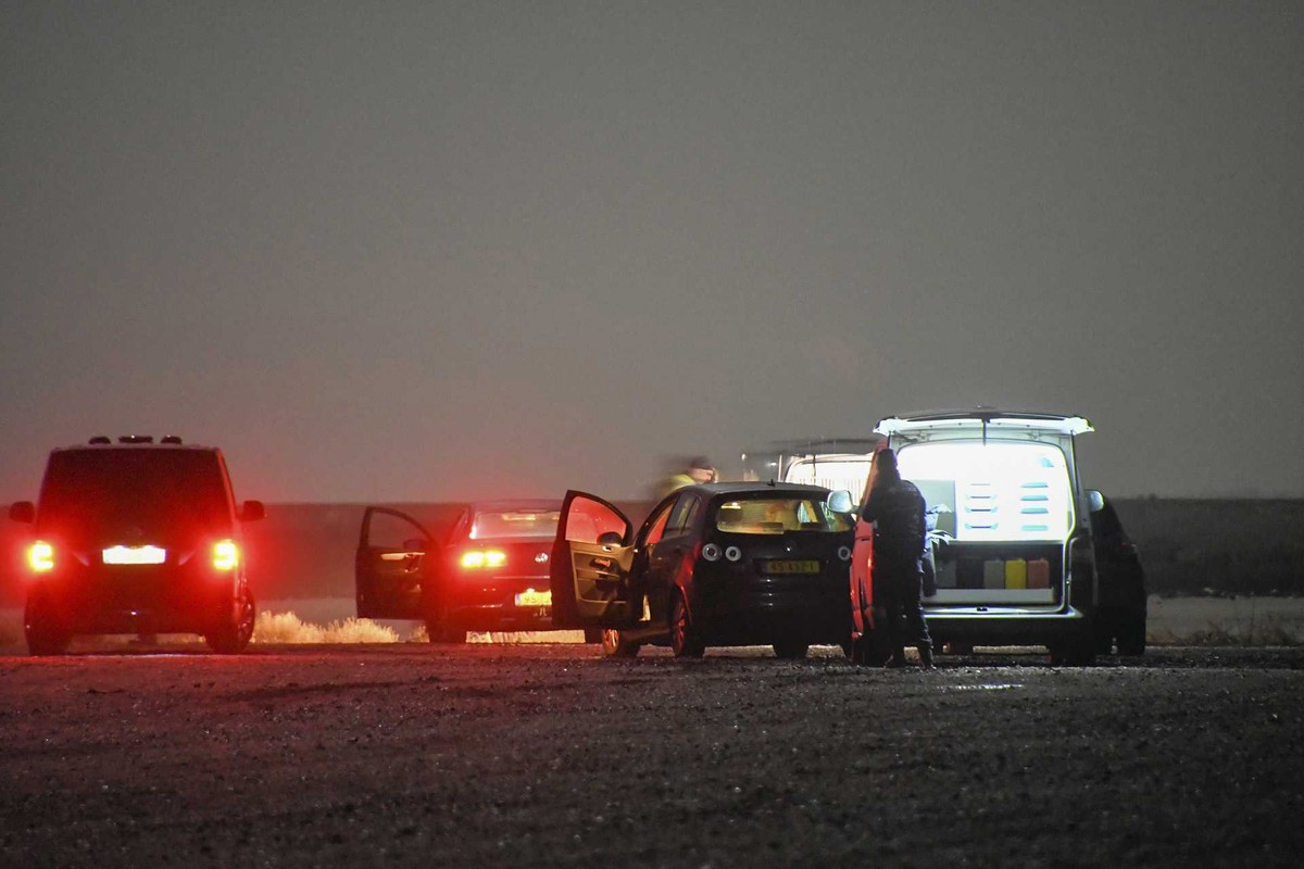 epa09691984 Police investigate the scene at Neeltje Jans in Zeeland, the Netherlands, on 17 January 2022, where the body of the missing 4-year-old Belgian boy Dean was found. A 34-year-old Belgian man ...