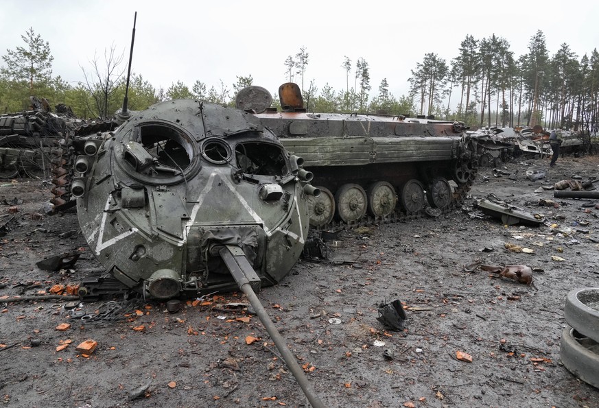 The letter V, the Russian forces emblem, is seen on a blown Russian tank turret in the village of Dmytrivka close to Kyiv, Ukraine, Saturday, Apr. 2, 2022. At least ten Russian tanks were destroyed in ...