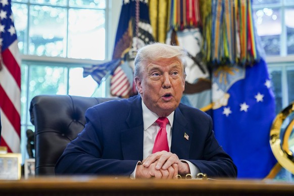 epa12300587 US President Donald Trump speaks in the Oval Office at the White House, Washington, DC, USA, 14 August 2025. President Trump delivered remarks and responded to questions on his presidentia ...
