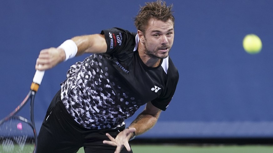 Stan Wawrinka, of Switzerland, serves to Kei Nishikori, of Japan, during the Western &amp; Southern Open tennis tournament Wednesday, Aug. 15, 2018, in Mason, Ohio. (AP Photo/John Minchillo)