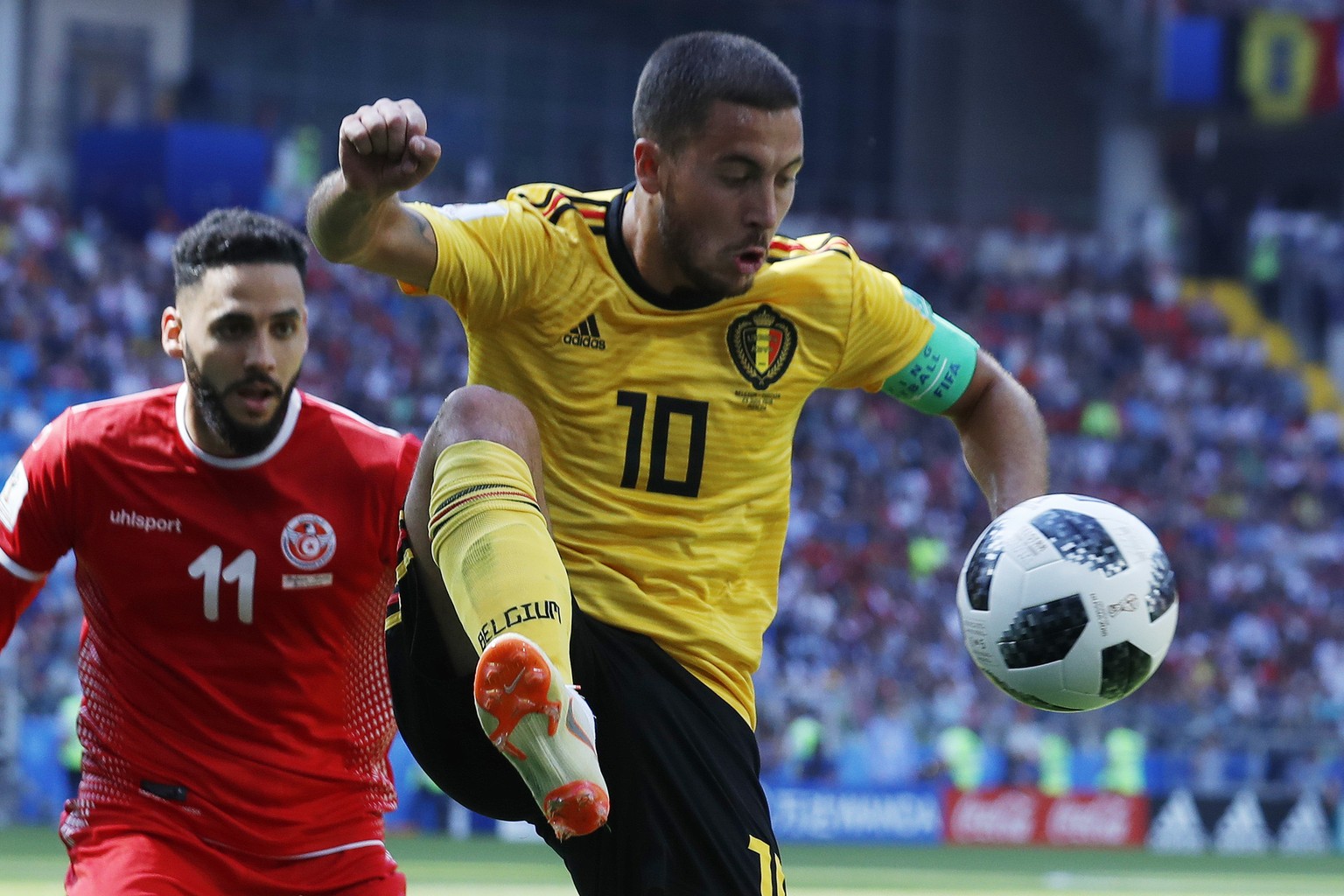 Belgium&#039;s Eden Hazard, right, and Tunisia&#039;s Dylan Bronn challenge for the ball during the group G match between Belgium and Tunisia at the 2018 soccer World Cup in the Spartak Stadium in Mos ...