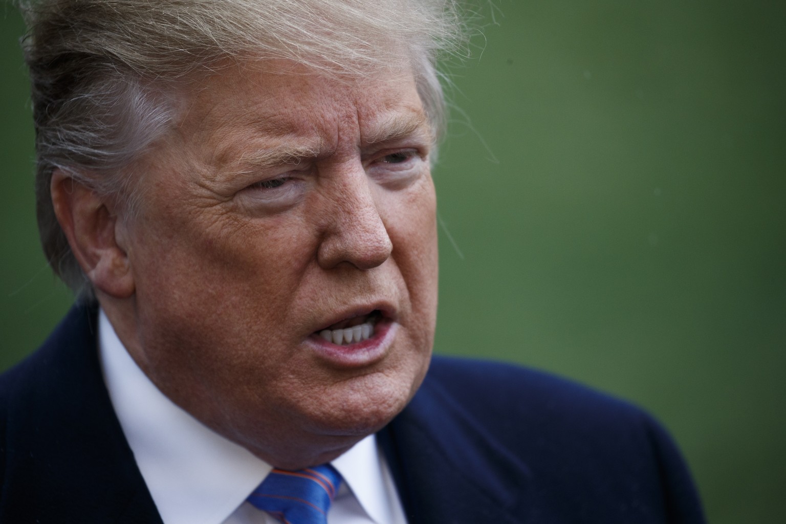 epa07486796 US President Donald J. Trump responds to a question from the news media as he walks to board Marine One on the South Lawn of the White House in Washington, DC, USA, 05 April 2019. Presiden ...