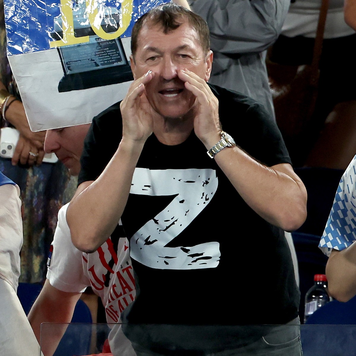 epaselect epa10428538 A spectator wears a 'Z' on his t-shirt as he cheers for Novak Djokovic of Serbia taking on Andrey Rublev of Russia in their quarterfinal match at the 2023 Australian Op ...