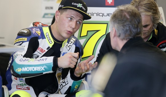 Dominique Aegerter of Switzerland talks with members of his team during an open practice for the Texas Moto2 race at the Circuit of the Americas Saturday, April 11, 2015, in Austin, Texas. (AP Photo/T ...