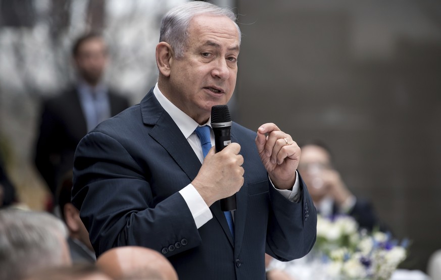 Israel&#039;s Prime Minister Benjamin Netanyahu speaks at the International Security Conference in Munich, Germany, Friday, Feb. 16, 2018 during a lunch meeting. (Sven Hoppe/dpa via AP)