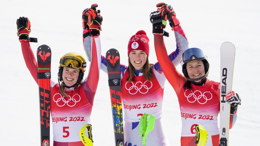 From left, Katharina Liensberger, of Austria, Petra Vlhova, of Slovakia, and Wendy Holdener, of Switzerland, celebrate after during the women&#039;s slalom round 2 at the 2022 Winter Olympics, Wednesd ...