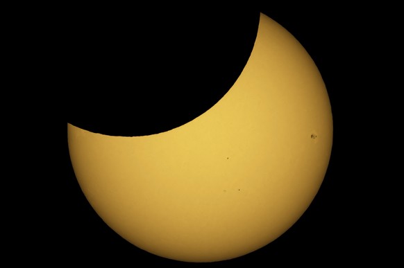 epa10264970 A view of a partial solar eclipse seen over Male Zlievce, Slovakia, October 25, 2022. EPA/PETER KOMKA HUNGARY FROM