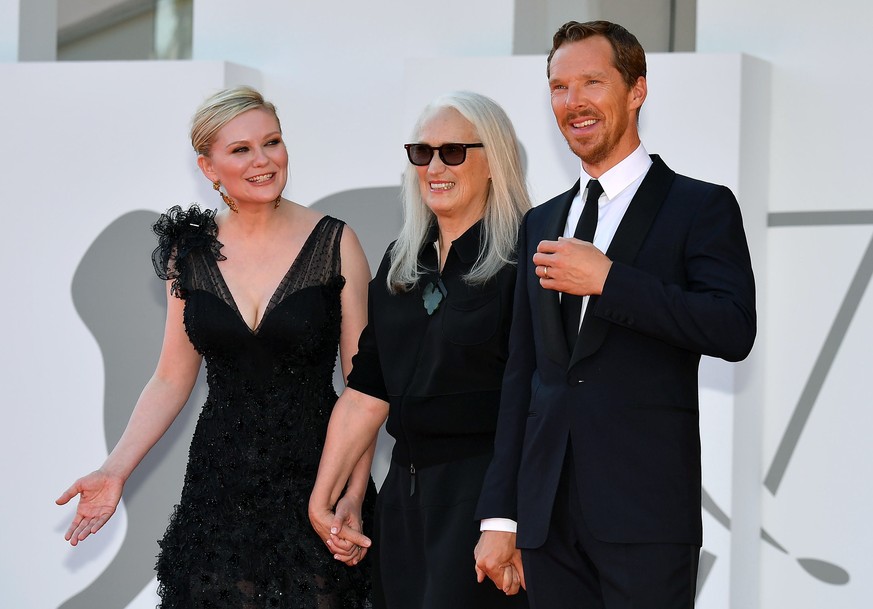 epa09443047 US actress Kirsten Dunst (L), New Zealand director Jane Campion (C) and British actor Benedict Cumberbatch arrives for the premiere of &#039;The Power of the Dog&#039; during the 78th Veni ...
