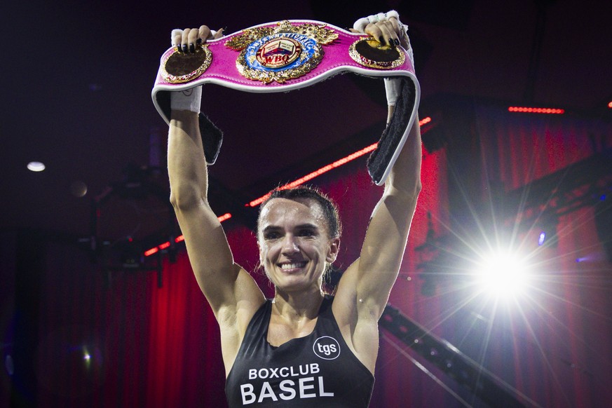 Gabriela "Balboa" Timar of Switzerland celebrates with the belt after winning a WBO International Mini-Flyweight fight against Yoselin Fernandez of Venezuela, at the Boxing Day meeting in Be ...
