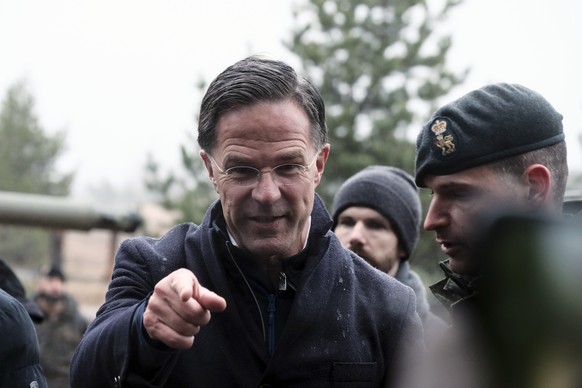 epa11721023 NATO Secretary General Mark Rutte reacts during an inspection of military equipment after watching a demostration of the &#039;Resolute Warrior&#039; military exercise carried out by the m ...