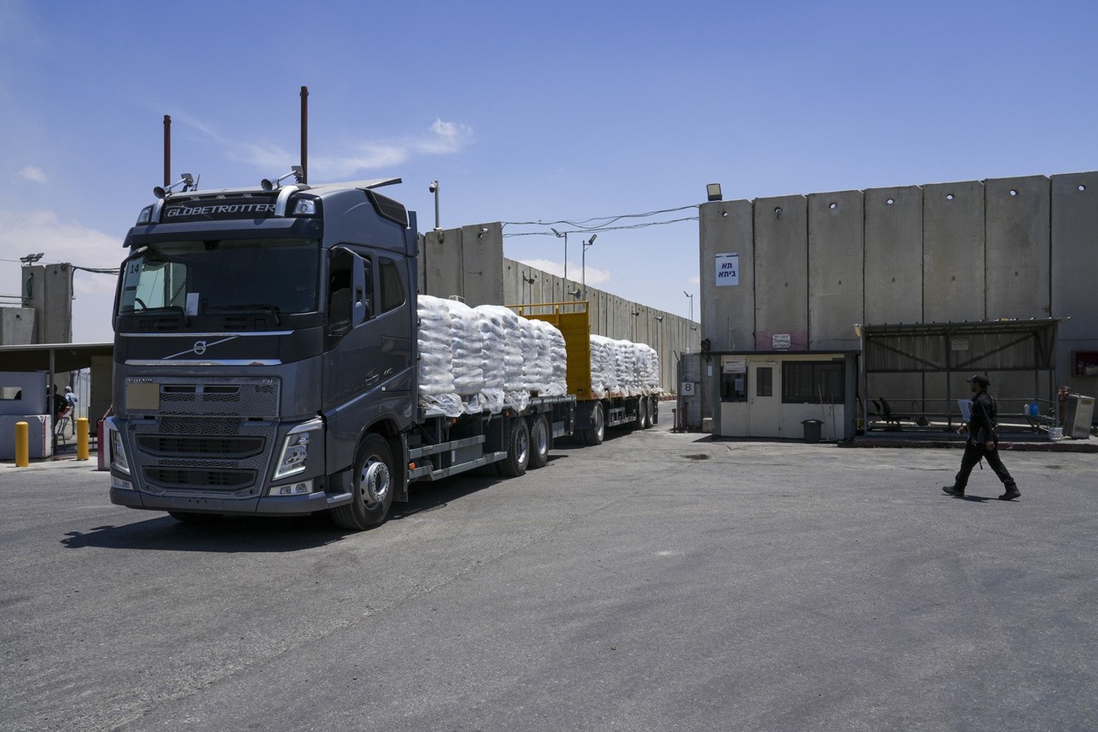 A truck with bundle of humanitarian aid for the Gaza Strip drive at the Kerem Shalom border crossing in southern Israel, Thursday, May 30, 2024. (AP Photo/Tsafrir Abayov)