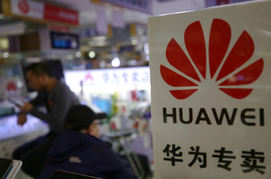 epa07311031 A Huawei logo is seen in a mobile phone store in Beijing, China, 23 January 2019. The US Justice Department is reportedly seeking the extradition of China&#039;s Huawei Technologies Co Ltd ...