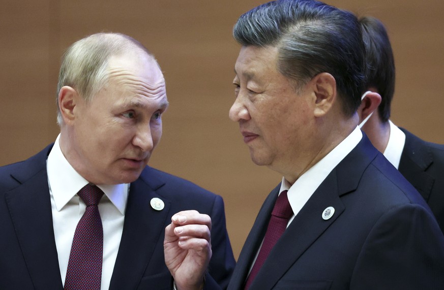 FILE- Russian President Vladimir Putin, left, gestures while speaking to Chinese President Xi Jinping during the Shanghai Cooperation Organization (SCO) summit in Samarkand, Uzbekistan, Sept. 16, 2022 ...