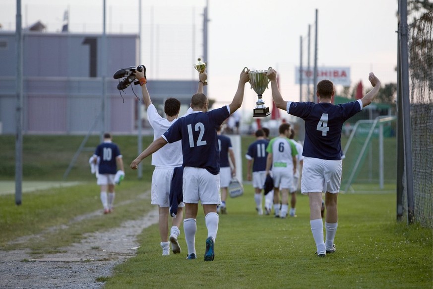 The amateur football players from the team UBS and winners of a regional soccer championship, are about to watch together the EURO 2008 European Soccer Championships match between Russia and Spain, in ...