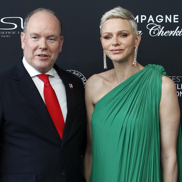 epa10019096 Prince Albert II of Monaco (L) and his wife Princess Charlene pose during the opening ceremony of the 61st Monte-Carlo Television Festival in Monaco, 17 June 2022. EPA/SEBASTIEN NOGIER