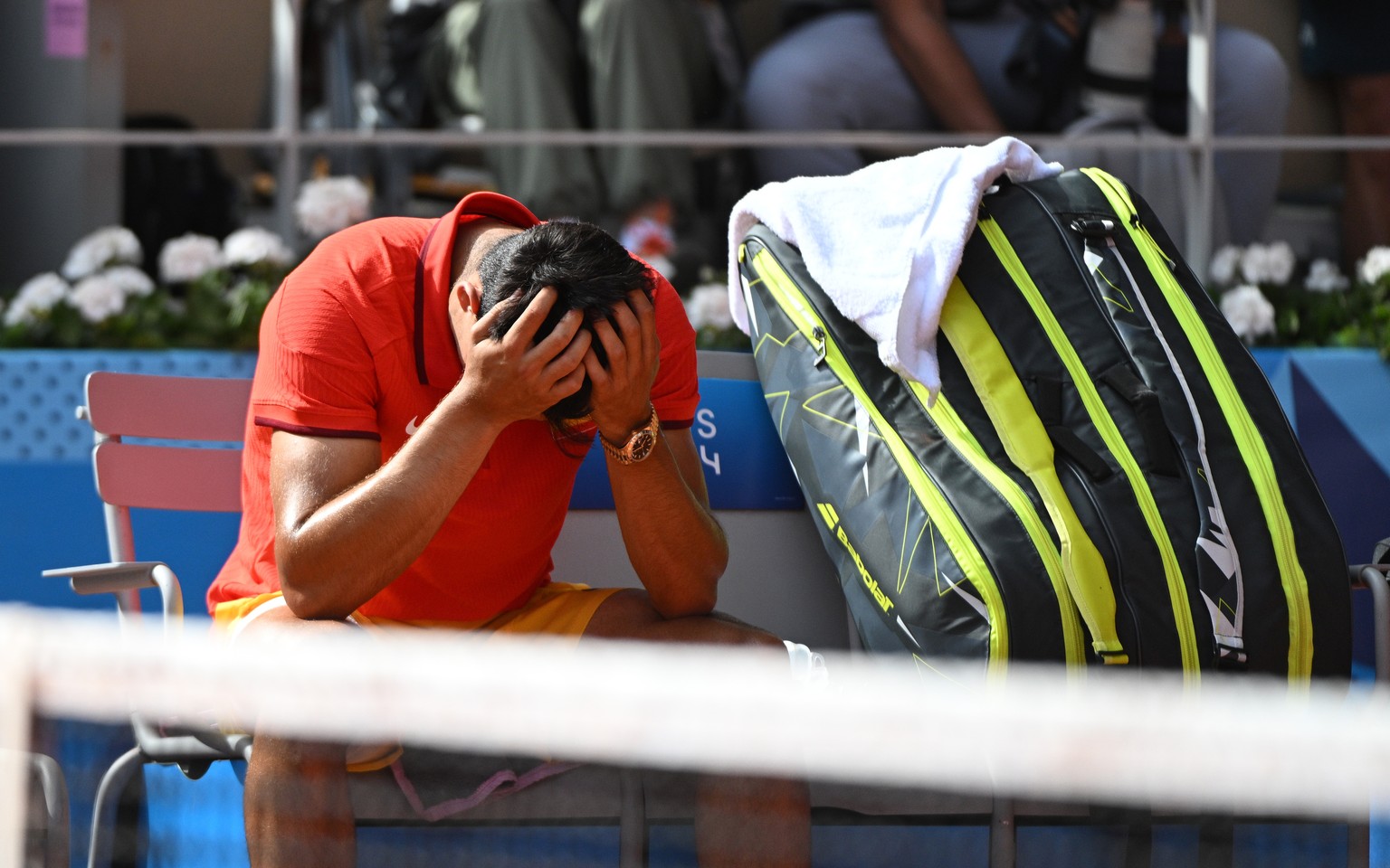 epa11525362 Carlos Alcaraz of Spain reacts after the Men Singles gold medal match against Novak Djokovic of Serbia, of the Tennis competitions in the Paris 2024 Olympic Games, at the Roland Garros in  ...